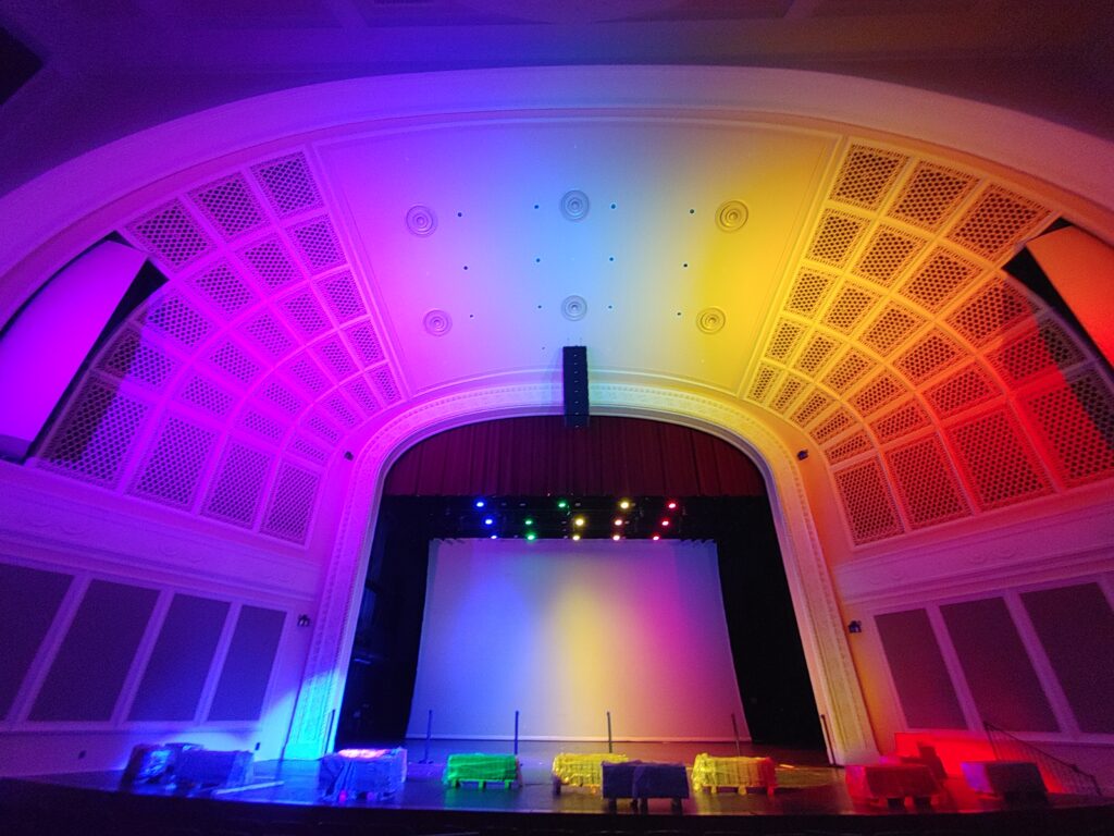 UNCG Auditorium bathed in a rainbow of light provided by new LEDs