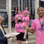 Dean bruce mcclung handing out cookies to first-year students