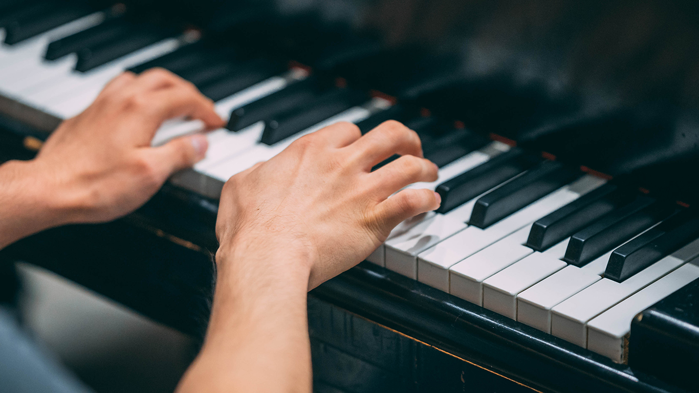 Hands playing the piano