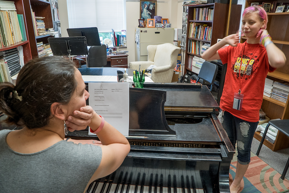 Student being instructed during Summer Music Camp.