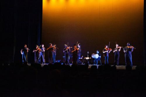 students performing onstage