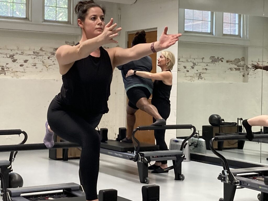Liz Anderson (First-year MFA) holds a pose in the School of Dance's Pilates Certification Class
