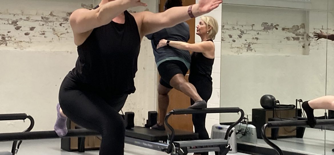 Liz Anderson (First-year MFA) holds a pose in the School of Dance's Pilates Certification Class
