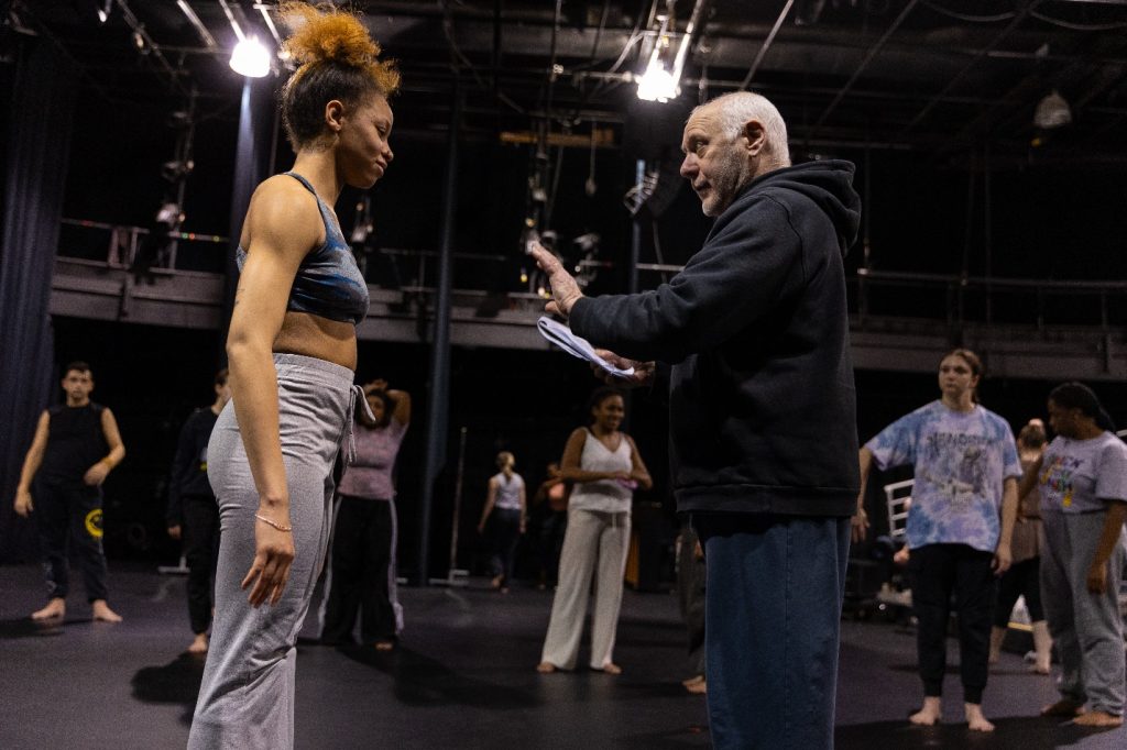 Dance instructor working with student