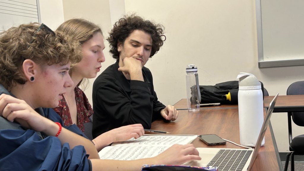 Saye, Anabelle, and Cengiz analyzing the Tchaikovsky Violin Concerto